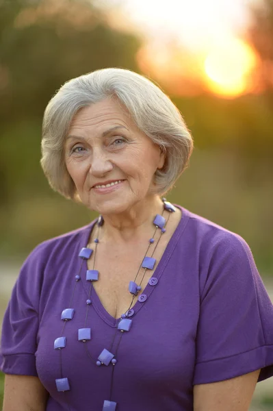 Senior woman in summer park — Stock Photo, Image