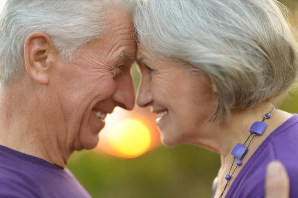 Mature couple   in summer park — Stock Photo, Image