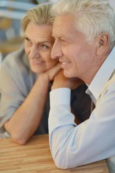 Mature couple in spring park — Stock Photo, Image