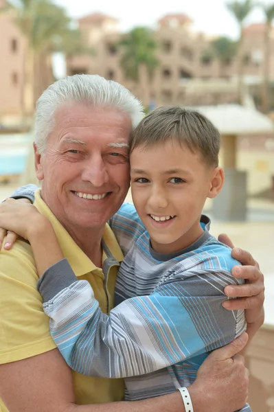 Senior man with grandchild at vacation resort — Stock Photo, Image