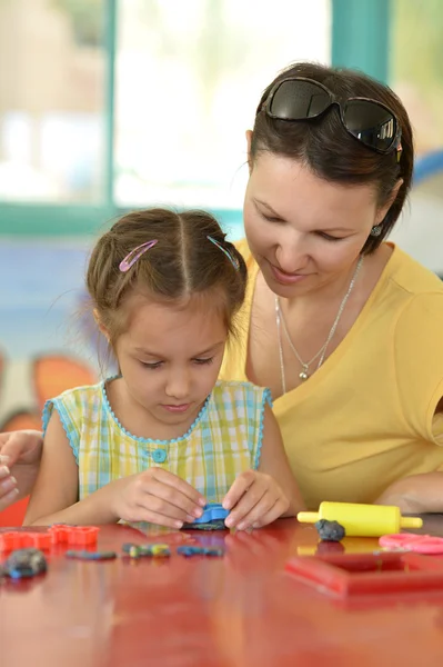 Little girl playing with mother — Stock Photo, Image