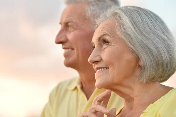 Elderly couple  on the background of sky — Stock Photo, Image