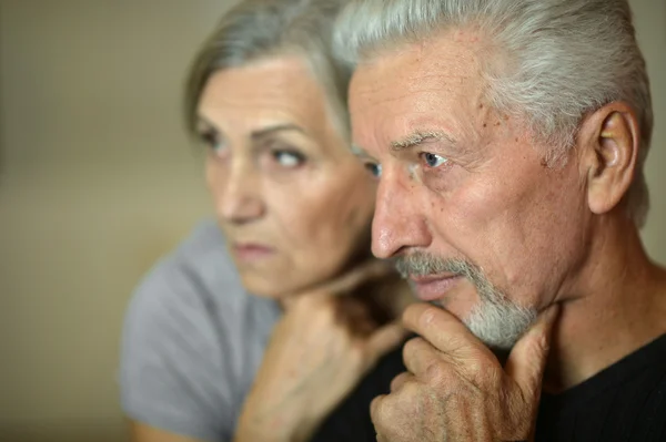 Mature couple near wall — Stock Photo, Image