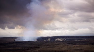 Steam and Smoke Rising From the Active Halemaumau Crater in Volc clipart