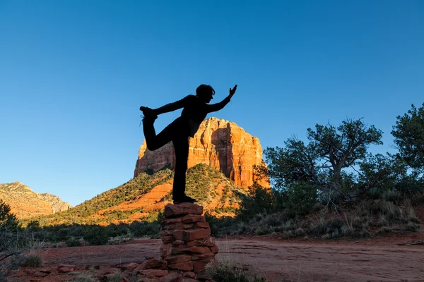 Woman Silhouetted in Yoga Pose — Stock Photo, Image