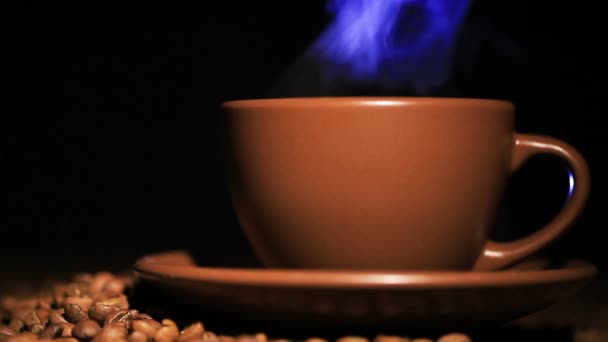 Brown cup with hot drink and coffee grains,  blue steam. — Stock Video