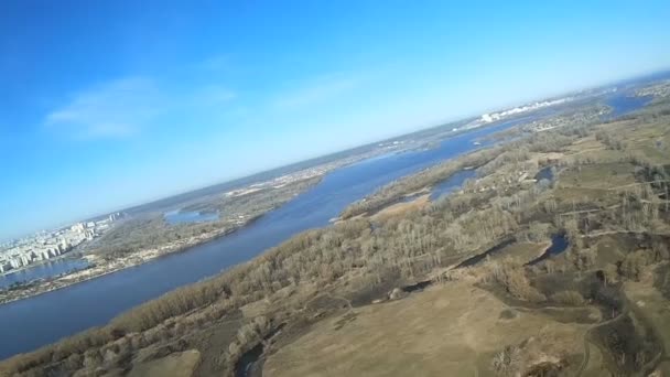 Spring Flight over  field and river . Aerial with lists like bird — Stock Video