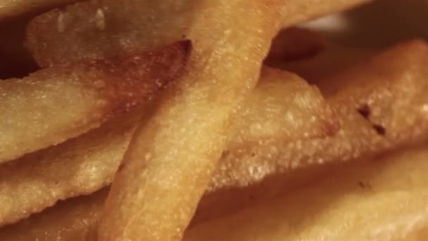 The plate with French fries rotates. Top close up  view — Stock Video