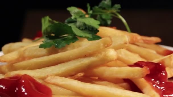 Fried French fries with ketchup and salad — Stock Video