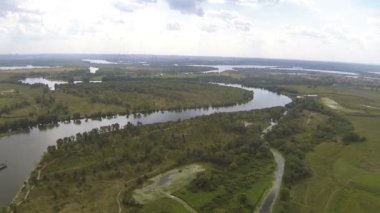 Slow Flight  over  river and fields . Aerial landscape panorama