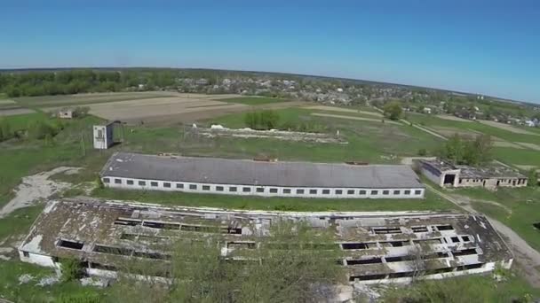 Over  destroyed  rural cowsheds. Aerial view — Stock Video