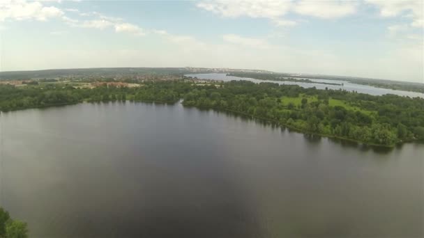 Slow Flight over park and  river in suburbs. Aerial — Stock Video