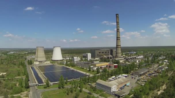 Over Thermal power plant in  wood .Aerial — Stock Video