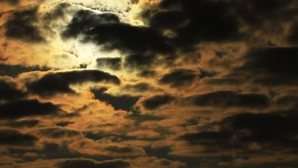 Drama sun through  orange  dark clouds in sky. Time lapse in red tones — Stock Video