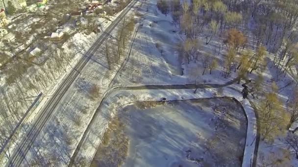 Flight over  frozen lake in  winter city. Aerial — Stock Video