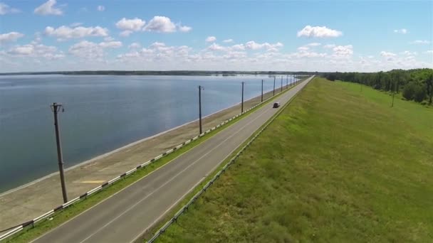 Beautiful road with car  and lake. Aerial shot — Stock Video
