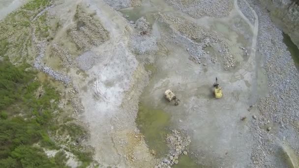 Pit on production of  stone with excavators. Aerial  top view — Stock Video