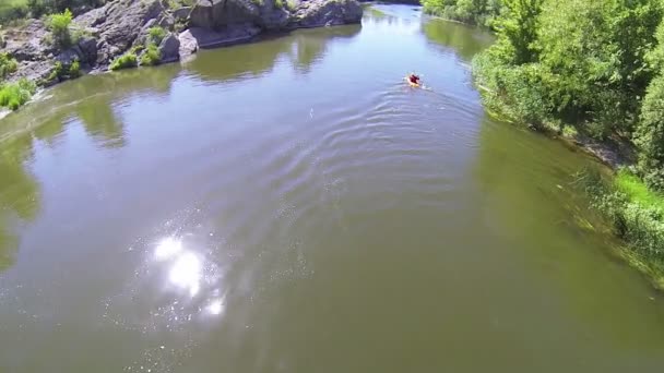 Flight over  person in  kayak on  quiet  river. Aerial top — Stock Video