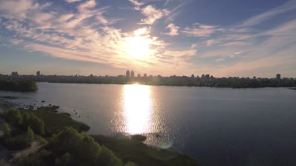 Flight over river coast in sunset time. Aerial landscape — Stock Video