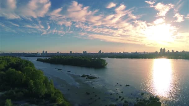 Flight over river coast in sunset time. Aerial landscape, rear flight — Stock Video