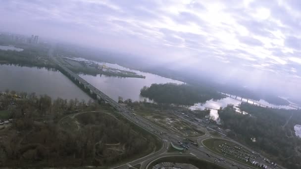 48 seconds Fly like bird  with turns  over autumn  suburb, road and bridge. City Kiev, Ukraine — Stock Video