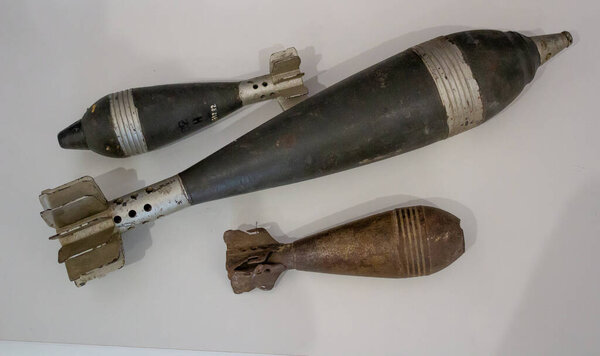 Ukraine, Kyiv - December 1, 2020: Old military shells and bombs. Severe attillery. A set of weapons. Weapon cartridges. Bomb, projectile, missile from the Second World War, museum piece.