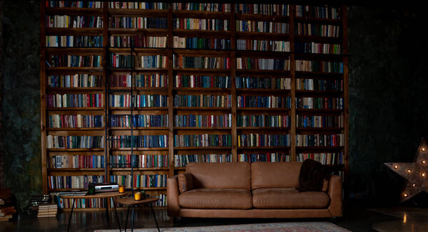 Book background. Selective focus. Blurred texture of old books. Bookshelves in the library.