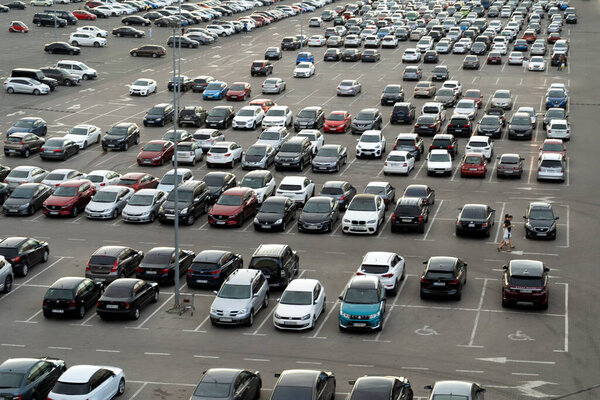 Ukraine, Kyiv - June 20, 2021: Parking cars near the shopping center Lavina . A lot of cars in the parking lot, top view