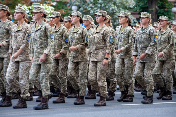 Ukraine, Kyiv - August 18, 2021: Military women and girls in uniform. Ukrainian military march in the parade. Army infantry. Combat step. Girl soldier and officer