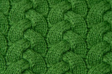 Yeşil Kablo Kumaş Kumaş yün süveter arka planı. Örgü yün tekstil.