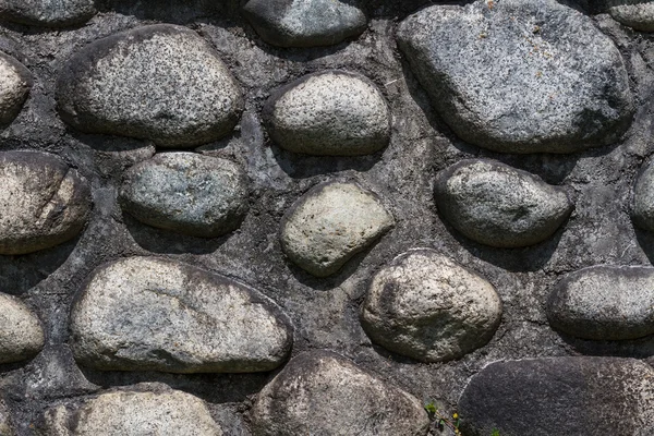 Wall with pebbles — Stock Photo, Image