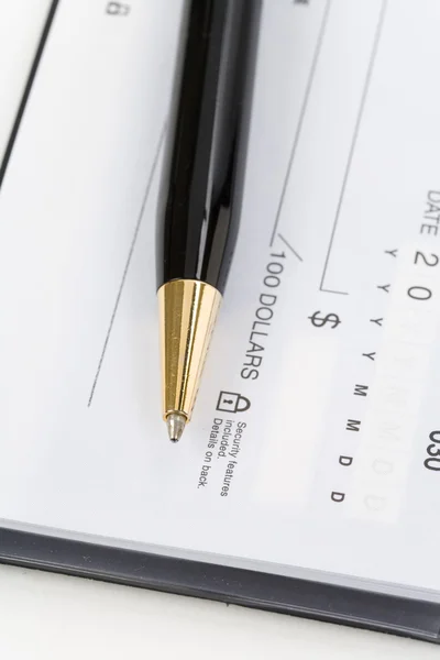 Checkbook and pen Stock Picture