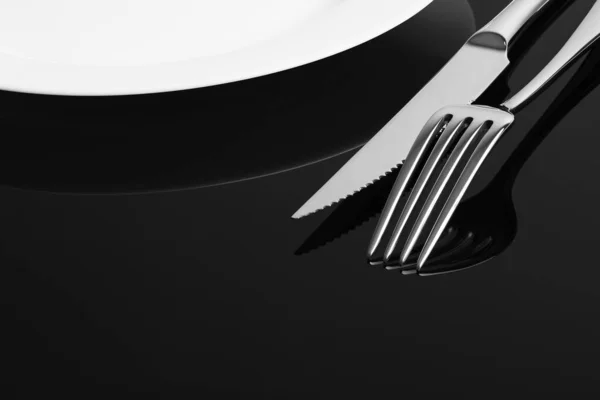 Close Fork Knife Empty Plate Black Background Space Text Stock Image