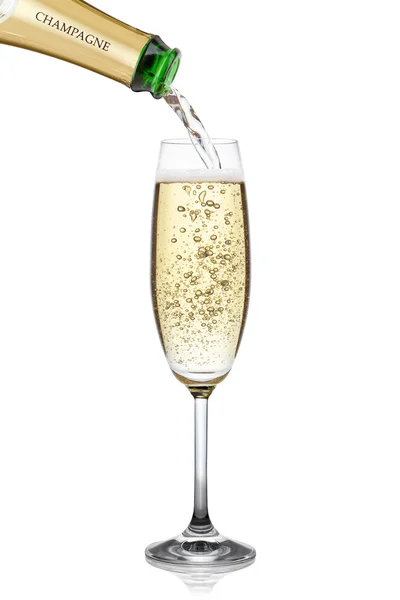 Champagne in een glas gieten. — Stockfoto