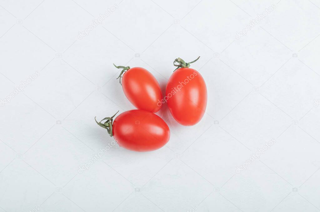 Close up photo of three cherry tomato. on white background