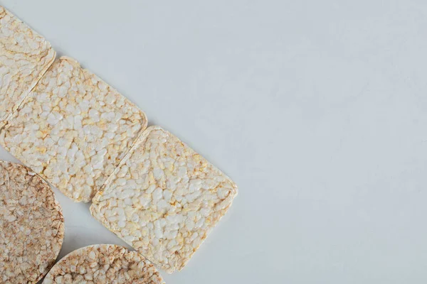 Two types of crispbread on white background