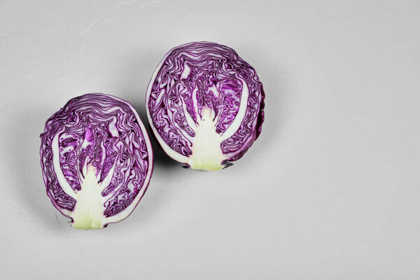 Fresh purple half sliced cabbage isolated on white background