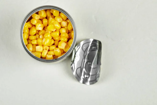A can of boiled sweet corn on a white background — Stock Photo, Image