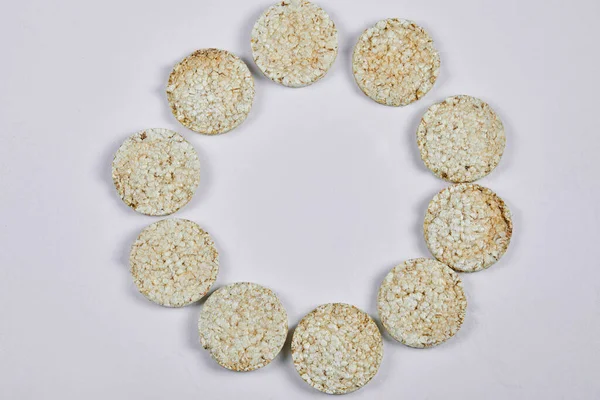 A pile of rice crackers on white background