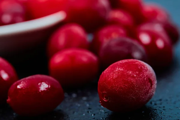 Ripe cornel berries on dark background. Close up — Stock Photo, Image