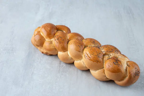 White braided bread on stone background. High quality photo