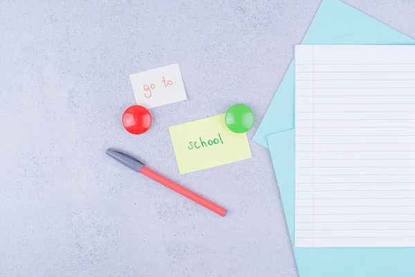 Back to school concept with notepads writing to go to the school. High quality photo