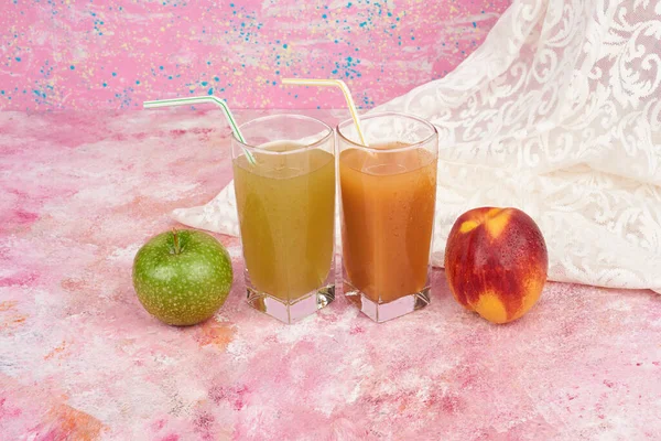 Mixed fruits with cups of juice. High quality photo
