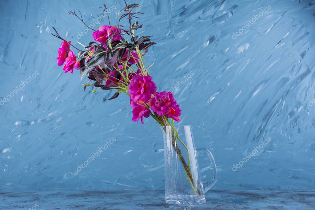 Beautiful Bouquet Of Fresh Purple Flowers In Glass Cup High Quality Photo 454091086 Larastock