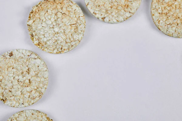 A pile of rice crackers on white background
