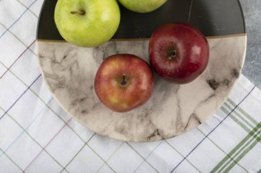 Marble plate of red and green apples on stone background. High quality photok