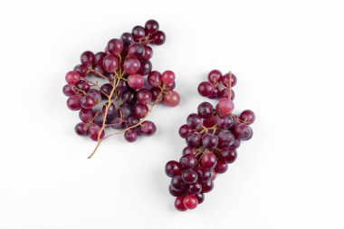 Cluster of fresh red grapes isolated on white background. High quality photo