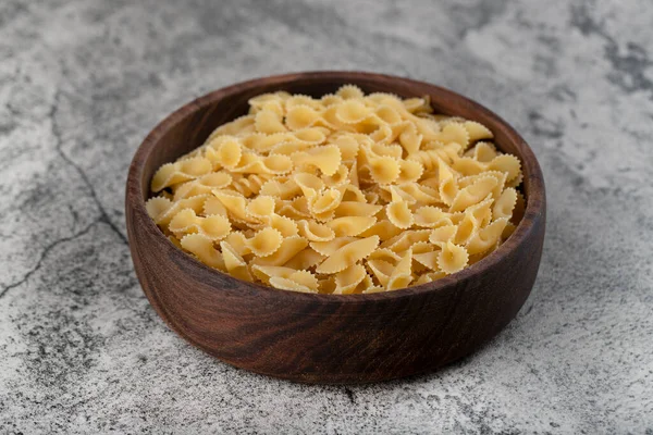 Wooden Bowl Raw Pasta Placed Stone Background High Quality Photo — Stock Photo, Image