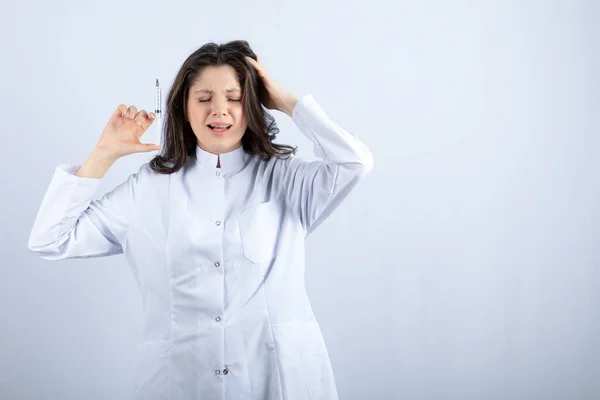 Photo Young Doctor Syringe Screaming White Background High Quality Photo — Fotografia de Stock