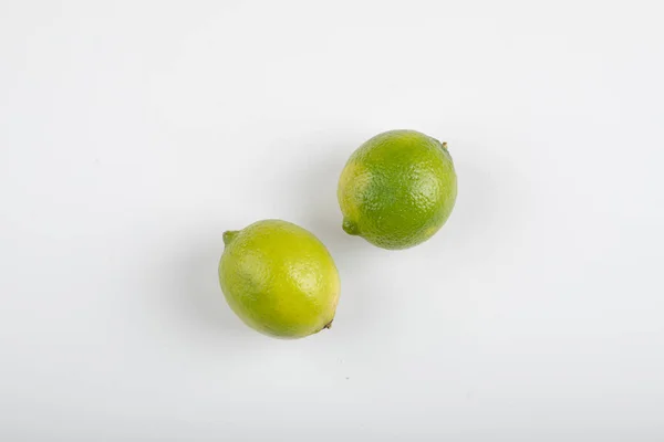 Two Ripe Lime Fruits Isolated White Background High Quality Photo — Stock Photo, Image